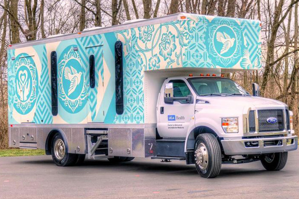 One of five mobile health clinics deployed for the INTEGRA study. Artwork for the clinic was designed by artist Shepard Fairey.